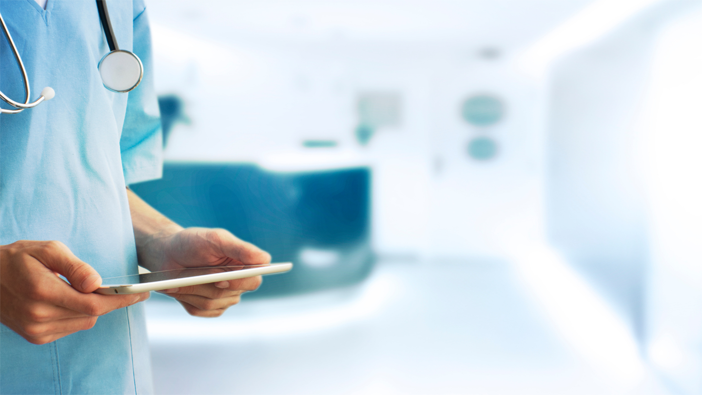 A doctor holding an electronic tablet