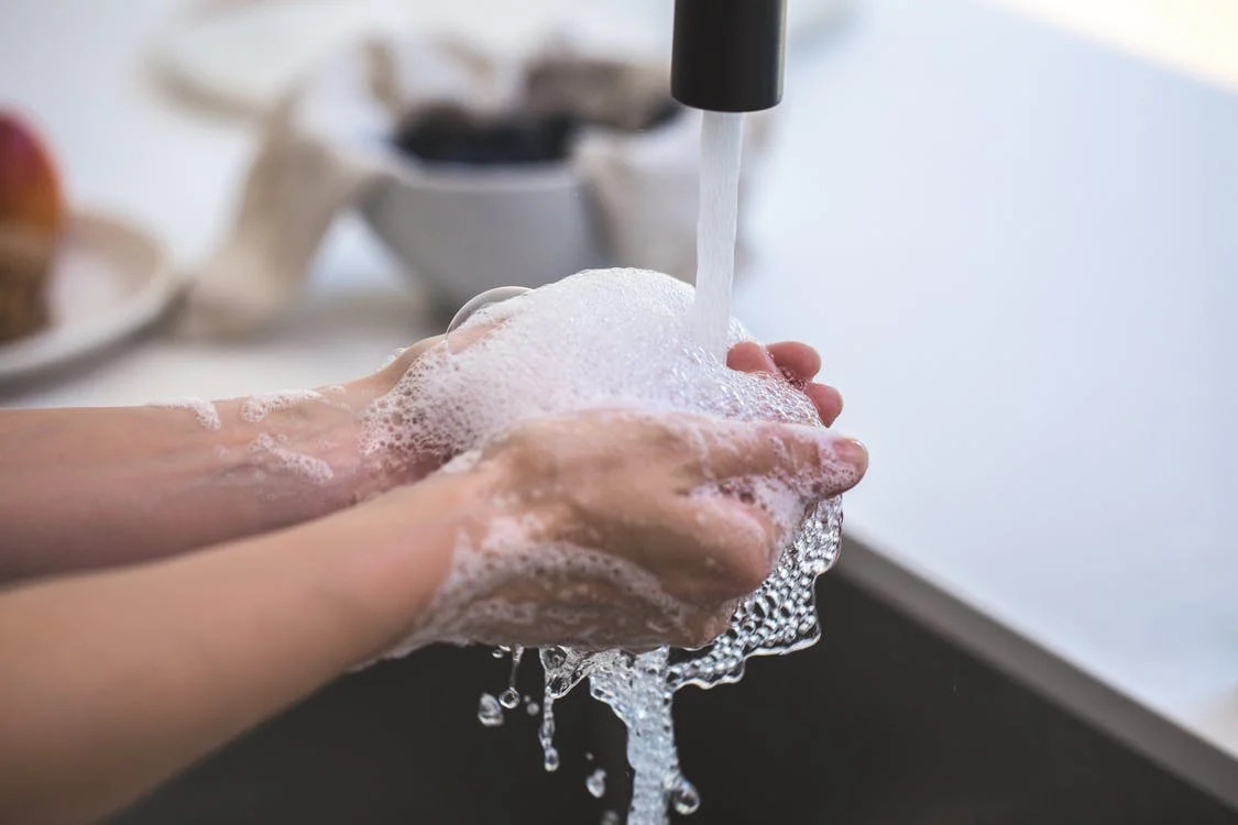 Using a water heater to clean hands